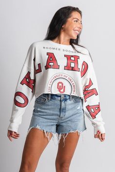 OU OKLA Phipps long sleeve crop sweatshirt white White Cropped Sweatshirt For Streetwear, White Cropped Cotton Sweatshirt, White Cropped Cotton Sweater, White Long Sleeve Cropped Sporty Sweater, White Cotton Cropped Sweater, White Long Sleeve Crop Top With Graphic Print, Trendy Long Sleeve Tops For Game Day, White Cotton Cropped Sweater With Long Sleeves, White Long Sleeve Cotton Cropped Sweater