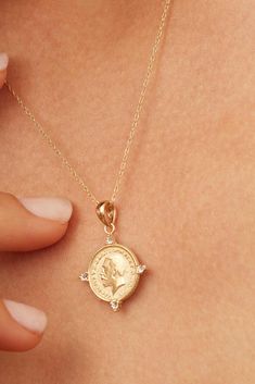 Our Legacy Coin Pendant Charm is the perfect brdige of history and style. Celebrating legacy and heirlooms, it depicts King George V, celebrated for his leadership during a pivotal era. The coin's vintage allure is enhanced by modern design elements, making it a versatile addition to any jewelry collection. Metal: 14k Solid Gold Dimensions: 20mm Coin Diamenter, 4mm Bale Opening Weight: 1.7 grams Origin: Crafted in Arezzo, Italy Collectible Coin-shaped Elegant Necklace, Elegant Commemoration Coin Pendant Jewelry, Classic Gold Jewelry With Coin Pendant, Classic Coin Necklaces, Elegant Coin Pendant Necklaces For Commemoration, Classic Gold Jewelry With Diamond Accents, Formal Heirloom Necklace Stamped 14k, Classic 14k Stamped Coin Jewelry, Classic Stamped 14k Coin Jewelry