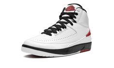 The Women’s Air Jordan 2 OG “Chicago 2022” is the women’s sizing of the modern reissue of the original colorway of Michael Jordan’s second signature shoe.  After a handful of special collaborations by Off-White, Union, and many others, the Jordan 2 was officially back in a regular release cycle in late 2021 and throughout 2022.  The return of the Jordan 2 “Chicago” is the proverbial “cherry on top” of all of the silhouette’s releases.  Styled identically from the original Jordan 2 “Chicago” from 1986, the modern version features a white leather construction with perforated detailing on the forefoot.  A tonal faux snakeskin overlay is found on the midfoot.  Fiery red accents appear on the heel counter below a red “NIKE” logo.  The Air Jordan 2’s classic “Wings” logo is found on the tongue. Jordan 2 Chicago, Logo Wings, 2022 Shoes, Air Jordan 2 Retro, Historic Colours, Air Jordan 2, Jordan Shoes Retro, Womens Air Jordans, Shoes Retro