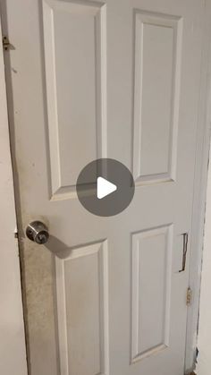 a white door with a video playing on it