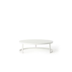 a white table sitting on top of a white floor