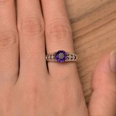 It is a natural amethyst ring, octagon cut, measures 7mm*7mm, weight about 1.46 cts. The basic metal is sterling silver and plated with rhodium. To change the metal to a solid gold (white/rose) or platinum is also available, please ask for a quotation if you want. You can also go to my shop Home for more elegant rings: https://www.etsy.com/shop/godjewelry?ref=hdr_shop_menu amethyst is birthstone of February More amethyst rings: https://www.etsy.com/shop/godjewelry?ref=seller-platform-mcnav&s Classic Amethyst Birthstone Promise Ring, Classic Octagon Amethyst Ring As A Gift, Classic Octagon Amethyst Ring As Gift, Classic Octagon Amethyst Ring For Gift, Amethyst Birthstone Ring In White Gold, Classic Amethyst Birthstone Ring With Accent Stones, Octagon Sapphire Ring For Anniversary, Octagon Sapphire Birthstone Ring For Anniversary, Classic Amethyst Birthstone Ring For Anniversary