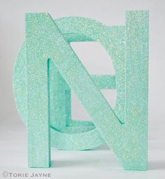 the letter n is made out of green plastic