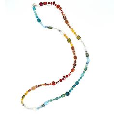 This necklace is made from a gorgeous mix of natural gemstones and Czech glass. Each necklaces is one-of-a-kind and contains carnelian, opalite, red aventurine, ruby jade, turquoise, teal jade and goldstone. Features a sterling silver lobster clasp and chain at the back. This versatile piece can be worn three ways: long, doubled, or as a bracelet. Adjusts from 40 inches to 44 inches long. Chalcedony Gemstone Necklace With Round Beads, Recycled Glass Gemstone Beads Jewelry, Recycled Glass Gemstone Beads, Fusion Gemstone Beaded Necklace, Artisan Single Strand Glass Necklace, Spiritual Multi-stone Agate Jewelry, Bohemian Glass Jewelry With Single Strand, Bohemian Single Strand Glass Jewelry, Bohemian Glass Single Strand Jewelry