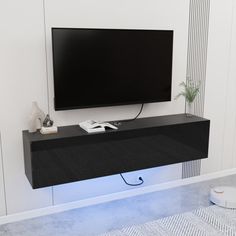 a flat screen tv mounted to the side of a wall