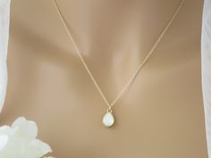 Complete your look with this simple petite Swarovski teardrop necklace. Beautiful in either White Opal or Black. Pendant measures 0.5 inches in length. Also available in sterling silver. Necklace lengths: 16 inches + a 2 inch extender 18 inches + a 2 inch extender Items arrive in a beautiful hand decorated gift box. Ready to ship in 3-5 business days. Minimalist Teardrop Jewelry For Weddings, Minimalist Teardrop Wedding Jewelry, Minimalist White Crystal Necklace For Wedding, Minimalist White Crystal Wedding Necklace, Minimalist Teardrop Jewelry For Bridesmaid, White Teardrop Jewelry For Bridal Shower, Wedding Jewelry With Delicate Teardrop Pendant, Teardrop Crystal Necklace For Wedding, Teardrop Pendant Crystal Necklace For Wedding