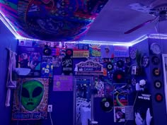 a room that has various items on the wall and lights above it, all in different colors