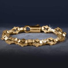 This bracelet is designed to be the perfect match to any outfit. Expertly crafted from premium grade stainless steel with a yellow gold finish. The ornately shaped links are meticulously designed, showcasing detailing that adds a touch of intricacy and luxury. A bracelet that exudes timeless elegance and sophistication. Luxury Stainless Steel Chain Bracelet With Rectangular Links, Gold Stainless Steel Oval Link Bracelets, Luxury Gold-tone Box Chain Bracelet, Classic Gold Bracelet With Solid Link Construction, Classic Gold Bracelet With Solid Link, Elegant Stainless Steel Bracelet With Rectangular Links, Elegant Stainless Steel Bracelets With Rectangular Links, Luxury Stainless Steel Chain Bracelet With Polished Finish, Rectangular Links Jewelry In Yellow Gold Stainless Steel