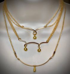 "This is Dayna's second necklace in photo 2 of her Reunion look. It is made of 18k gold plate and is nickel and lead free and hypo allergenic. Also available in Rhodium Silver plate and is nickel and lead free. *Dayna wears a 15\" inch length with a 1\" inch extension chain." Elegant Gold-tone Nickel-free Necklaces, Elegant Nickel-free Brass Charm Necklaces, Gold Sterling Silver Chain Necklace Nickel Free, Adjustable Double Strand Gold Necklace, Nickel-free Gold Necklaces For Anniversary, Elegant Brass Necklaces With Unique Variations, Nickel-free Gold Necklace For Anniversary, Elegant Brass Necklace With Unique Variations, Nickel-free Gold Anniversary Necklaces