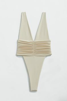 Our best-selling one-piece swimsuit in brand new shades! Equal parts sophisticated and sexy, the Echo One-Piece hugs your body and highlights your hips with a high-legged cut and minimal back coverage. The ruched side detail is met by moderate bust coverage and supportive shoulder straps. Super soft and super stretchy, this one-piece doubles as a bodysuit for an effortless beach-to-bar look. Just like an echo, you will want to repeat this purchase in every shade. Product description Minimal cove Cut Out Bathing Suits, Cheap White Fun Swimwear, Neutral Swimwear, Cabo Aesthetic, Bridal Swimsuit, Cute One Piece Bathing Suits, High Cut One Piece Swimsuit, Sophisticated Swimwear, Luxury Swimsuits