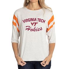 Elevate the style of your game day tee with this Virginia Tech Hokies Sabrina Jersey T-shirt. It features the team name and logo accentuated by contrast-color side stitching and sleeve stripes. A rounded hem gives this Virginia Tech Hokies shirt a more comfortable fit and feel. Collegiate Tops With University Logo For Game Day, Collegiate Athletic Heather Tops For Game Day, Collegiate Style Tops In Athletic Heather For Game Day, Varsity Tops With University Logo For College, Sporty College Tops With University Logo, Varsity Athletic Heather Tops For College, Collegiate Athletic Heather Tops For Sports Events, Varsity Tops For Game Day, Collegiate Style Tops With Text Print For Game Day