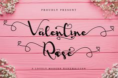 valentine rose script with flowers on pink wood planks and white baby's breath