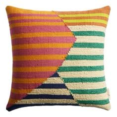 a multicolored pillow with two different stripes on the front and one in the back