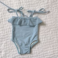 New Never Worn Size Is 6-12 Months Originally $71 Blue Summer Bodysuit For Playwear, Blue Fitted Bodysuit For Playtime, Fitted Blue Bodysuit For Playtime, Fitted Blue Bodysuit For Playwear, Playful Blue Bodysuit For Summer, Summer Solid Color Bodysuit For Playtime, Playful Blue Summer Bodysuit, Spring Light Blue Swimming Bodysuit, Playful Light Blue Swimwear For Spring