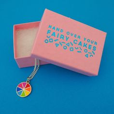 "Hand Over Your Fairy Cakes & Nikki McWilliams With this teeny tiny charm, you can now take all the colours with you wherever you go. Made from hard-wearing enamel, there are eight beautifully vivid colours to brighten up even the gloomiest day (We live in Scotland, we've had plenty of chances to test this for ourselves!). This tiny charm is made of enamel and nickel-free stainless steel. This listing is for one charm on an 18 inch silver-plated chain. Measurements: Charm - 1.5 cm in diamete Alternative Fashion Outfits, Fairy Cakes, Colour Wheel, Tiny Charm, Gloomy Day, Alternative Style, Happy Wednesday, Color Wheel, Classic Fashion