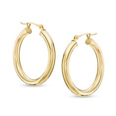 Big on style, these hoop earrings are a great go-with-everything look. Crafted in warm 14K gold, each earring measures 3.0 x 25.0mm. Polished to a bright shine, these earrings secure with latch backs. Timeless Hypoallergenic Hoop Earrings, Formal Yellow Gold Hoop Earrings With Ear Wire, Timeless Hoop Earrings For Anniversary, Timeless Hoop Earrings With Spring Ring Clasp, Yellow Gold Oval Hoop Earrings With Ear Wire, Classic Yellow Gold Hoop Earrings For Anniversary, Anniversary Hoop Earrings With Shiny Finish, Classic Hoop Earrings For Anniversary, Timeless Hypoallergenic Hoop Earrings For Anniversary