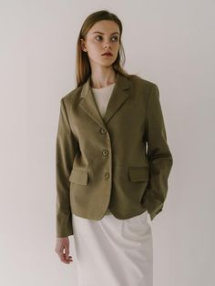 This jacket showcases a blazer with a notched lapel, contributing to a refined and professional silhouette. It is styled with a two-button front closure which is standard for a classic blazer design. The tailored garment includes patch pockets, adding a touch of casual functionality. Its fabric appears smooth and likely has a fine weave, indicating a quality construction.- The blazer features a structured shoulder, enhancing the garment's tailored form.- The sleeves terminate at the wrist, with no visible buttons or embellishments on the cuffs.- This piece, with its timeless design, could be versatile in both formal and semi-formal settings. Classic Button-up Blazer For Work, Tailored Button-up Blazer For Career, Classic Single-breasted Blazer With Notched Lapel, Classic Button-up Semi-formal Blazer, Classic Button-up Blazer For Semi-formal Occasions, Classic Flat Front Sport Coat For Office, Classic Sport Coat With Flat Front For Office, Classic Career Blazer With Welt Pockets, Classic Blazer With Welt Pockets For Career