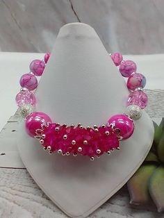 "Handmade and designed by me-fuchsia glass crystal beads-various glass beads-silver tone beads-fits a 7 \" wrist-silver tone-lobster clasp-1\" extender chain-this bracelet makes a great gift for your relatives or reward yourself" Pink Crystal Bracelet With Round Beads, Pink Crystal Bracelet With 8mm Beads For Party, Pink Crystal Bracelets With Round Beads, Adjustable Beaded Crystal Bracelet Made Of Czech Glass, Pink Crystal Bracelets With Faceted Beads, Pink Large Beads Bracelet For Party, Pink Crystal Beaded Bracelets With Round Beads, Pink Crystal Beaded Bracelets With Faceted Beads, Pink Crystal Beaded Bracelet With Faceted Beads