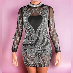 Be The Life Of The Party In This Sexy Dress! Featuring; Rhinestone And Pearls With Feathers On The Arms, Detail, Sheer Throughout The Whole Dress With Polyester Followed By A Fitted Wear. Stretch Fit. Rhinestone Mini Bodycon Dress For Party, Rhinestone Mini Bodycon Party Dress, Party Mini Bodycon Dress With Rhinestones, Mini Bodycon Dress With Rhinestones For Party, Mini Sequin Dress With Rhinestones For Party, Mini Sequin Party Dress With Rhinestones, Black Rhinestone Mini Dress For Club, Black Mini Dress With Rhinestones For Club, Party Mini Dress With Rhinestones In Black