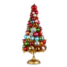 a small christmas tree with ornaments on it's top and gold base, against a white background