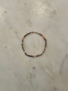 pumpkin chai lattes, totally in. a stylish and stackable fall themed bracelet made with 18k gold plated non tarnish beads, also totally in. Seed Bead Pumpkin Bracelet, Pumpkin Spice Bracelet, Adjustable Gold-tone Metal Beaded Bracelet, Pumpkin Beads Jewellery Gold, Pumpkin Chai Latte, Pumpkin Emerald Beads, Gold Beaded Bracelet, Pumpkin Chai, Beads Bracelets