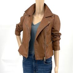 A Faux Leather Moto Jacket Featuring Ribbed Seam Detail, Buttoned Flat Collar, Zip-Up Front Closure, Zippered Slanted Front Pockets, Long Sleeves With Zippered Sleeves. Fully Lined. Length 20.5”, Chest Ptp 18”- Excellent New Condition With Tags. Trendy Fitted Faux Leather Outerwear, Fitted Faux Leather Moto Outerwear, Fitted Moto Outerwear In Faux Leather, Fitted Faux Leather Biker Jacket For Spring, Moto Style Faux Leather Outerwear For Fall, Spring Biker Faux Leather Outerwear, Fitted Moto Outerwear For Fall, Brown Moto Outerwear For Spring, Casual Faux Leather Biker Jacket For Spring