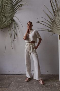 Upgrade your summer wardrobe with our organic cotton two-piece set. Made with sustainability in mind, this set offers both comfort and style. Pair it with our linen short sleeve shirt for a breezy and effortless look. Explore our collection of linen women's sets, perfect for embracing the boho style. Whether you're going on a summer holiday or simply enjoying the warm weather, our linen clothing line has you covered. Stay chic and comfortable with our summer holiday clothes designed for women wh Casual Linen Summer Set, Casual Linen Sets For Summer, Casual Linen Sets For Vacation, Casual Wide Leg Summer Sets, Casual Wide Leg Sets For Summer, Casual Linen Beach Set, Casual Linen Beachwear Set, White Linen Summer Sets, Cotton Summer Sets With Relaxed Fit