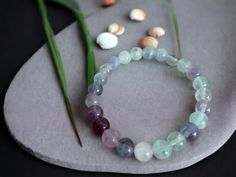 A precious stone bracelet that you can gift to yourself. This precious jewel is a fluorite bracelet. This crystal bracelet is the ideal children's gift. Our beaded bracelet model is handmade jewelry. This stone jewelry is made of precious beads. Chakras: Especially the crown chakra is extremely compatible with all chakras, including the throat and heart chakras. Gain in Use Feature: * It is recommended to use it as a neck necklace for spiritual serenity, lack of self-confidence, lack of expressi Fluorite Gemstone Bracelets With Round Beads, Handmade Fluorite Beaded Bracelets As Gift, Fluorite Natural Stone Beaded Bracelets As Gift, Fluorite Gemstone Beads Bracelets For Healing, Fluorite Gemstone Beads Bracelet For Healing, Precious Stones Bracelet, Neck Necklace, Bracelet Model, Fluorite Bracelet