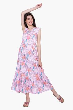 The Roseate Spiral Bird Maxi Dress is the perfect blend of comfort and style. The dress features a V-neck, elasticated waist, and ruffles detail around the neck and at the hem. It is made from a luxurious silk blend and features a beautiful pink geo floral pattern. The tie-up detail at the neck adds a touch of sophistication to the dress and makes it a stunning choice for any occasion. Enjoy the comfort and style of this beautiful maxi dress from your vacations to a sunny brunch in town. Style w Leopard Bag, Beautiful Maxi Dresses, Neck Ruffle, Mini Tote, Bag Dress, Hand Beading, Chic Look, Pattern Making, Playsuit Jumpsuit