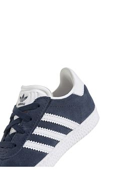 Initially designed in '91 as a training shoe for top athletes, the iconic Gazelle sneaker has been refreshed with stretchy laces for your little athlete. Pull-on style with elastic laces Leather and synthetic upper/textile lining/rubber sole Imported Low-top Training Sneakers With Laces, Sporty Blue High-top Sneakers With Elastic Laces, White High-top Sneakers With Elastic Laces For Jogging, White Sole Sneakers With Laces For Training, Sports High-top Sneakers With Elastic Laces And White Sole, Adidas Sporty Sneakers, Adidas Sporty Sneakers With Laces, Adidas White Sneakers With Elastic Laces, Adidas Sneakers With Elastic Laces And White Sole