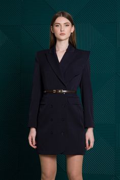 Keep it classic in this double-breasted blazer dress designed with an asymmetrical collar. - notched collar - asymmetrical detail with functional outbreast pocket - long sleeves - double-breasted button closure - functional front flap pockets - shift silhouette - mini length - fully lined Belt is not included. Color: navy Fabric: 65% polyester, 30% viscose, 5% elastane Lining: 95% viscose, 5% elastane For Size 36 EU / 2 US: length - 34.6" (88 cm), sleeve - 24'' (61 cm) Our model wears a 2 US siz Elegant Single Breasted Blazer Dress For Winter, Tailored Luxury Skirt Suit For Formal Occasions, Elegant Winter Blazer Dress, Single Breasted, Luxury Tailored Skirt Suit For Formal Occasions, Elegant Double-breasted Outerwear With Notch Lapel, Elegant Lapel Collar Blazer Dress For Winter, Elegant Double Breasted Long Sleeve Formal Suit, Elegant Double Breasted Long Sleeve Suit, Tailored Belted Blazer Dress With Notch Lapel