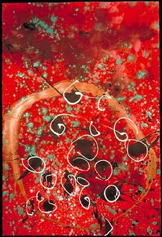 an abstract painting with circles and hearts on red paint splattered paper, in the center is a gold circle surrounded by small black dots