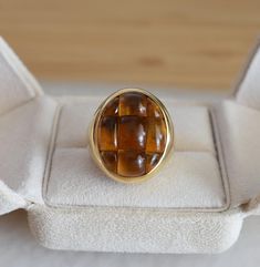 Vintage Designer Ring, Mosaico Pomellato, Pomellato Ring, 18k Gold and citrine ring, vintage fashion ring, woman fashion ring, estate ring, birthday Ring, Citrine Ring, 18k gold, unisex ring, US ring, gift for her, rare vintage ring, Cocktail ring. This is a signed Pomellato Mosaico model ring. This vintage ring is crafted in 18-carat gold and adorned with citrines. The citrines, skillfully cut to create a checkerboard pattern, inspired the name of this ring model. Please note that this model is Formal Fine Jewelry Cabochon Ring, Formal Fine Jewelry Ring With Cabochon, Formal Cabochon Signet Ring, Formal Fine Jewelry Signet Ring With Cabochon, Timeless Cabochon Rings For Formal Occasions, Timeless Cabochon Sapphire Ring Gift, Timeless Gift Sapphire Cabochon Ring, 14k Gold Cabochon Dome Ring For Anniversary, Formal Yellow Gold Oval Cabochon Rings