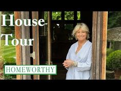 a woman standing in front of a door with the words house tour homeworthty on it