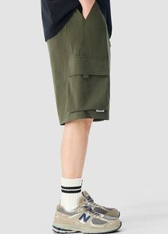 Experience functionality and style with our Cargo Utility Shorts, complete with a zippered pocket for the modern man on the go. Crafted from a breathable blend of 90% nylon and 10% spandex, these shorts feature a low waist, loose straight fit, and ice silk quick-drying properties for ultimate comfort. The edgy design includes a durable dual-duty stitch, ample storage with a large utility pocket, and a classic straight-cut hem for a relaxed silhouette. Versatile and comfortable, these shorts are Shorts Cargo, Modern Man, Army Green, Zipper, How To Wear