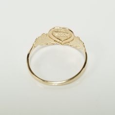 "Thanks for shopping our vintage estate store. We tend to sell well below wholesale and truly hope you enjoy all of our items. Many of the items are one of a kind, so please enjoy scrolling through the pictures and hopefully something will catch your eye. Brown spots are from camera or reflections. Estate 14k yellow gold monogram cursive capital M heart ring. Custom made ring for our shop. Ring size: 3 Setting: 7.5mm 1/4\" to 3/8\" Band width: 1.4mm Weight: 1.09 grams Marked 14k and it's sweet. Victorian 14k Gold Jewelry With Hallmark, Victorian Jewelry In 14k Gold With Hallmark, Vintage Engraved Oval Diamond Ring, Vintage Oval Engraved Diamond Ring, 14k Gold Signet Ring With Maker's Mark As Gift, Vintage 14k Gold Cluster Ring Hallmarked, Victorian 14k Gold Cluster Ring For Anniversary, Gift Ring With Maker's Mark, Vintage Hallmarked Yellow Gold Cluster Ring