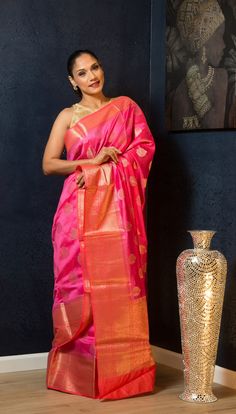 Elevate any occasion with this exquisite pink silk saree, embellished with golden floral embroidery. Perfect for weddings, it promises a comfortable and unforgettable experience. Pink Tissue Silk Saree With Dori Work, Pink Tissue Silk Saree With Traditional Drape, Pink Silk Traditional Wear With Dori Work, Silk Traditional Wear With Dori Work In Pink, Elegant Pink Saree With Dori Work, Pink Tissue Silk Traditional Wear With Pallu, Pink Tissue Silk Saree For Festivals, Pink Chanderi Saree For Wedding, Elegant Pink Art Silk Traditional Wear