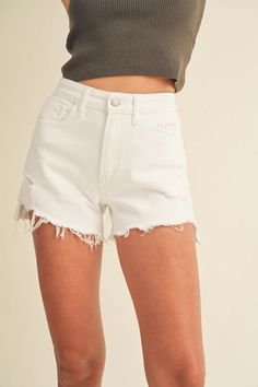 Embrace your summer style with the Vintage Frayed Hem Short. These will be your go-to pair of shorts for every summer season. Featuring a distressed hem and a maximum stretch fit, the Vintage Frayed Hem Short are both functional and stylish. Composition and Fit: The vintage design of these shorts suggests a relaxed, comfortable fit. Here's what you can expect: Rise: The rise sits at the mid-waist, offering a flattering silhouette that elongates the legs. Hip and Thigh: Expect a comfortable fit t Trendy Jean Shorts For Summer, Trendy Summer Jean Shorts, White Bottoms With Built-in Shorts For Summer Outings, Trendy Bermuda Shorts For Summer, Trendy Cotton Shorts For Summer, Trendy High Rise Shorts For Summer, Cotton Jean Shorts For Summer, Casual Cutoff Shorts For Summer, White Bermuda Shorts With Built-in Shorts For Vacation