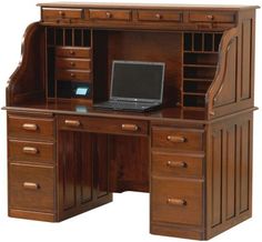 a computer desk with drawers and a laptop on it