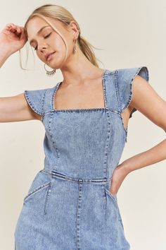 CUTENESS OVERLOAD! This wide leg denim jumpsuit is perfect for spring and summer, with playful tie details, smocked backing, and ruffle sleeves. Don't miss out on this must-have piece! Fits true to size Neck Stretches, Ruffle Sleeves, Denim Jumpsuit, Wide Leg Denim, Cuteness Overload, Square Neck, Stretch Denim, Front Pocket, Smocking