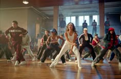 a group of young people dancing in a dance studio