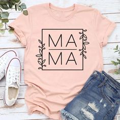 If you are looking for the perfect adorable Bella and Canvas Mama Shirt, floral mama shirt, toddler mom shirt, boy mom tee, girl mom t shirt, cute mama shirt, or new mom gift you've come to the right place.  This super soft Bella and Canvas Mama shirt is perfect for almost any occasion. It comes in 15 different colors. Design is printed in black on the following colors: White, Ash, Heather Mauve, Natural, Military Green, Steel Blue, Heather Ice Blue, Pink, Charity Pink, and Heather Peach. Design Summer Matching Tops With Name Print, Matching Funny Print Summer Tops, Trendy Pink Tops For Mother's Day, Trendy Pink Top For Mother's Day, Family Matching Letter Print T-shirt For Spring, Matching Relaxed Fit T-shirt For Summer, Matching Relaxed Fit Summer T-shirt, Family Matching Name Print T-shirt For Summer, Mother's Day Family Matching Tops With Letter Print