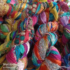 many colorful headbands are stacked together