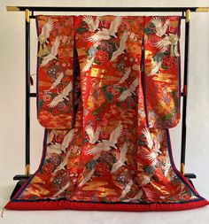 "Gorgeous red silk gold brocade in vintage wedding KIMONO UCHIKAKE JUNI-HITOE imperial style. JUNI-HITOE has been worn at special occasions such as weddings, royal ceremonies or imperial noble events since the HEIAN period and it means twelve layers originally. This JUNI-HITOE was made into modern style and is a single layer of kimono with three layers color trims with lining. Rare type of top quality textile with full of Japanese motifs in multi color. Crane, SAKURA cherry blossom, Chrysanthemu Traditional Red Kimono For Tea Ceremony, Traditional Gold Kimono For Wedding, Traditional Red Kimono For Wedding, Traditional Red Silk Kimono, Traditional Gold Ceremonial Kimono, Kimono Styles, Japanese Motifs, Kimono Art, Tree Peony