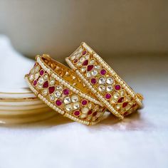 Premium quality pachi kundan openable kada bangle in pink color. This Jadau bangle is made with pure brass and best quality Ahemadabadi pachi kundan with beautiful pearl details to style you for wedding, engagement, party or reception.  Next to real look on your big day with this beautiful intricate piece of jewelry.  All orders Ship same day if placed before 4:00 PM EST  Sold as pair Sizes for bangles are Indian sizes so check your exact size as shown in picture before placing and order.  If yo Traditional Kundan Bangle For Puja, Traditional Gota Work Bangle For Diwali, Festive Gota Work Bangle For Puja, Kundan Jewelry With Gota Work For Puja, Kundan Bangle For Diwali Puja, Kundan Bangle For Puja And Diwali, Festive Kundan Bangle For Marriage, Kundan Bangle For Puja During Diwali, Heavy Kundan Bangle For Wedding