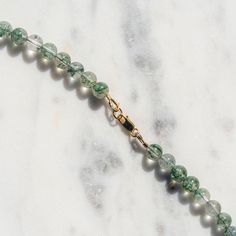 Hand strung natural green rutilated quartz with gold filled findings. 16" Green Tumbled Gemstone Beads Jewelry, Green Rutilated Quartz Meaning, Black Rutilated Quartz, Eco Hair, Golden Family, Rutilated Quartz Necklace, Ceramic Fiber, Golden Rutilated Quartz, Hair Shop