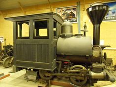 an old train is on display in a museum