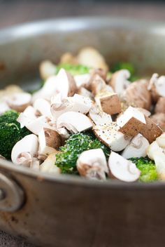 mushrooms, broccoli and other vegetables in a pan