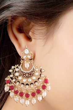 Product Features: Color: Maroon Base Metal: Alloy Work: Red Enamel Glided with Kundans and Pearls Plating Material: 18K Gold Plated Earring Dimension: L- 10 CM x W – 8 CM Occasion: Festive Disclaimer: There will be slight difference in digital to actual image Red Chandelier Earrings For Festive Parties, Red Chandelier Earrings For Party And Festive Occasions, Festive Red Chandelier Earrings For Party, Red Chandbali Bridal Earrings For Party, Red Chandelier Earrings For Party And Festivals, Red Danglers For Party Festivals, Red Danglers For Party And Festivals, Red Chandbalis For Celebration, Festive Red Hoop Earrings As Gift