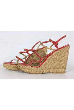 Get ready for the warm weather in these chic espadrille wedges. Their bold red embossed leather straps add a fabulous cool touch to these sandals. Perfect to pair with your light weight sun dresses. Size 10 M Leather upper & lining Made in Spain Ankle strap w/ gold-tone buckle Espadrille wedge heel Man made sole Intertwined straps Very light wear on sole Heel height 5.25" Red Summer Sandals With Removable Insole, Red Leather Wedge Sandals For Summer, Red Round Toe Wedge Sandals For Summer, Red Wedge Sandals With Round Toe For Summer, Summer Wedge Sandals With Red Sole And Round Toe, Spring Closed Toe Wedge Sandals With Red Sole, Red Beach Sandals With Removable Insole, Summer Wedge Sandals With Red Sole And Ankle Strap, Beach Wedge Sandals With Red Sole And Round Toe